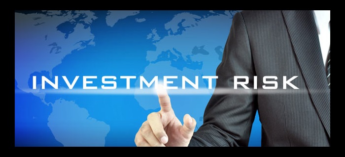 Investment Risk text with man and globe in background