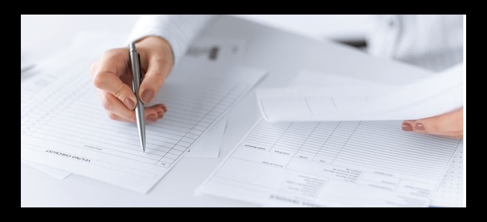 Woman filling out paperwork 