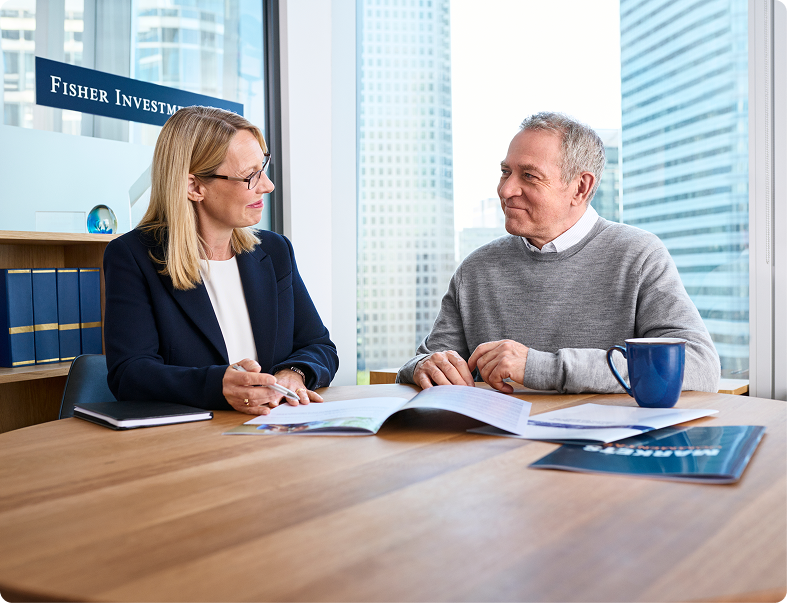 Photo of clients talking to adviser