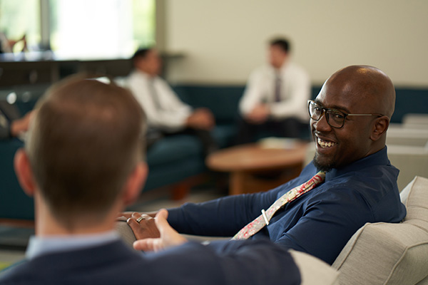 Professional dressed men talking