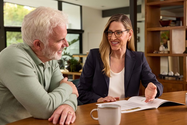 Photo of couple talking to adviser