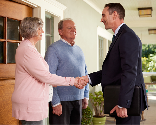 Photo of couple talking to adviser