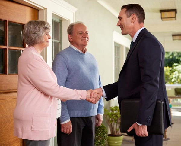 Photo of couple talking to adviser
