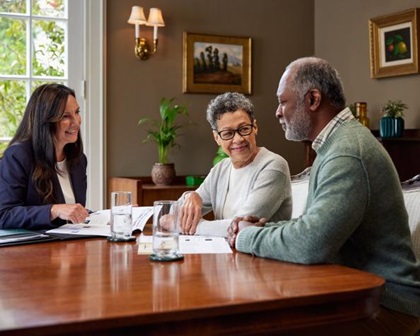 Woman shaking hands with adviser