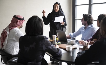 Riyadh business team listening to project manager