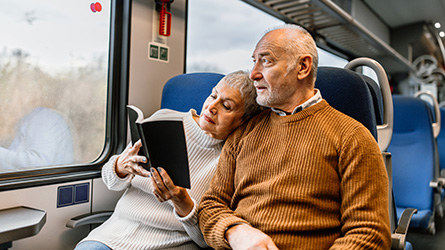 Couple ride a train together