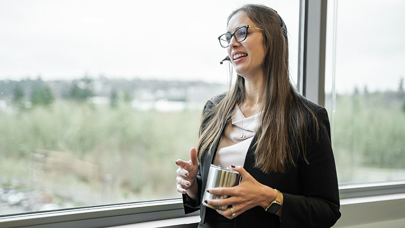businesswoman on the phone while looking out the window 