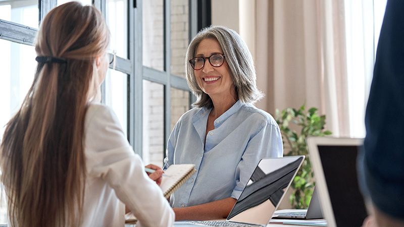 business woman and client discussing financial goals