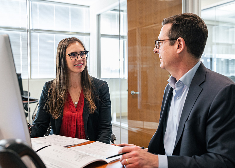 Two business professionals discuss retirement