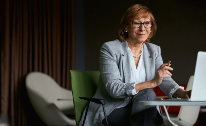 A Fisher Investments' employee discussing ongoing portfolio management on a video call.