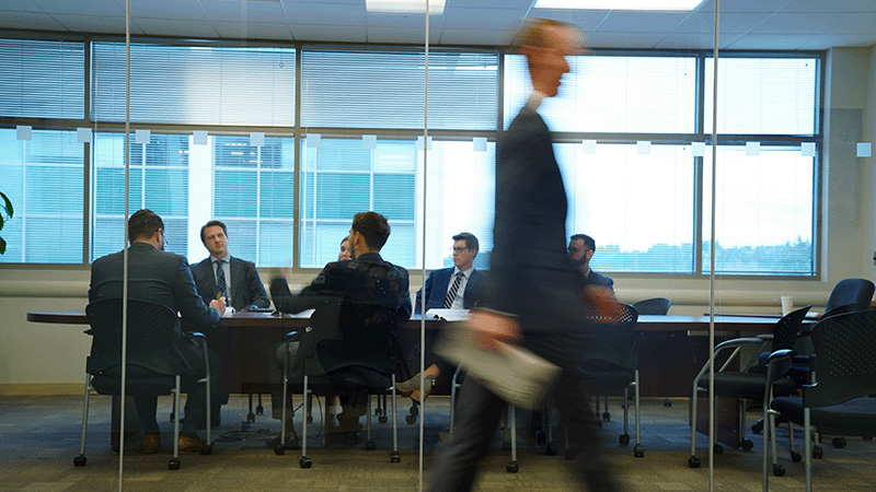 group of fisher employees working in an conference room 