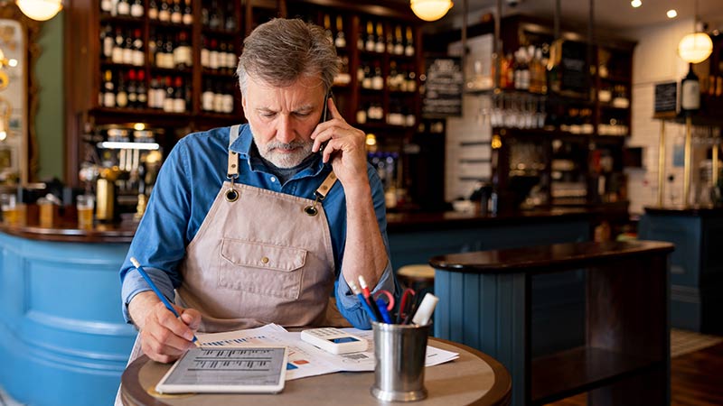 restaurant owner talking on the cellphone