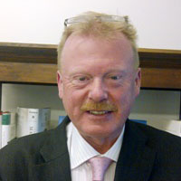 private client director john toll in a black suit