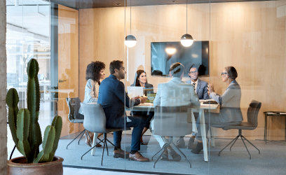 Financial Portfolio Management Team Discussing Risk Management, Global Diversification, and Current Market Conditions