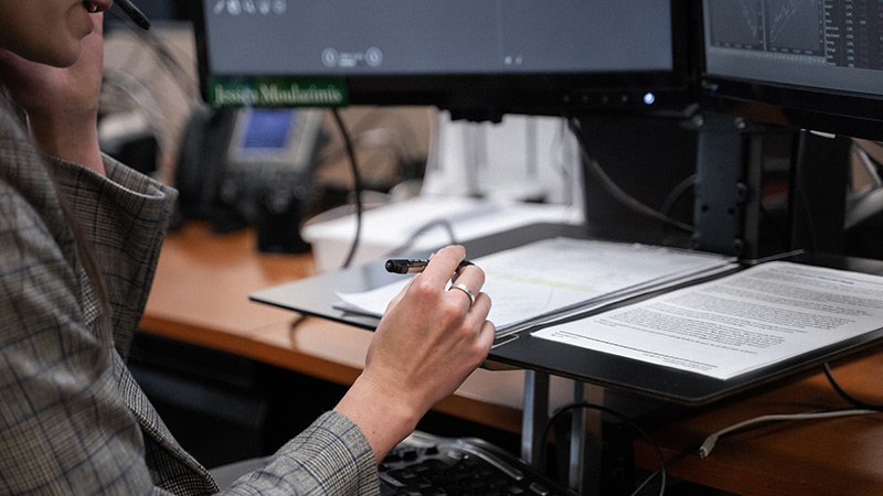 close up of woman's hand holding a pen
