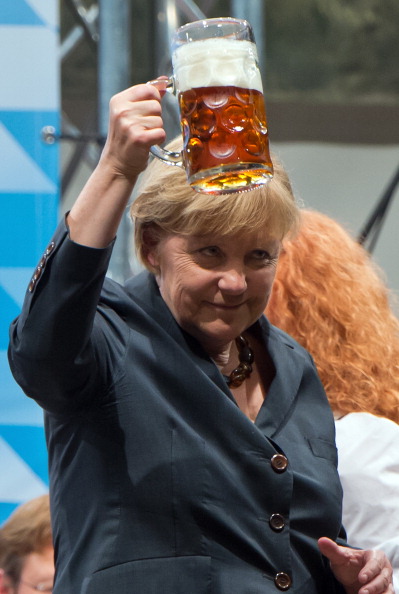 Angela Merkel holding beer