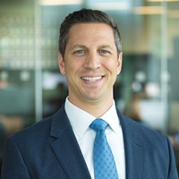 regional vice president Andrew Mallardi in a blue suit