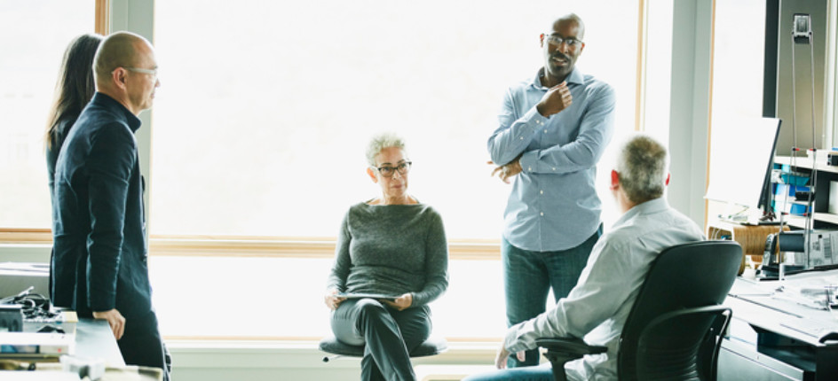 A group of professionals talking to each other