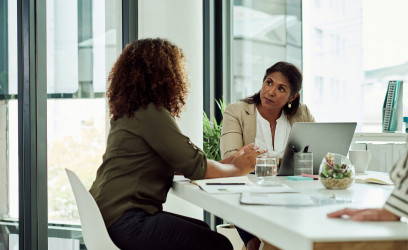 Fiduciary Investment Adviser Meeting With A Client About Financial Goals and A Personalized Investment Portfolio