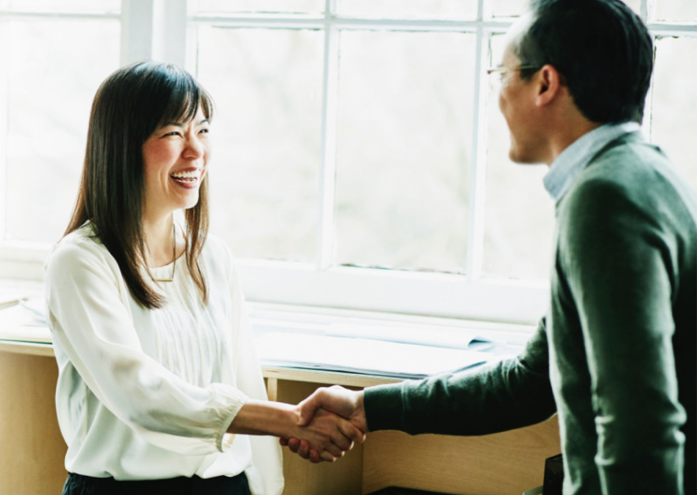 two people shaking hands