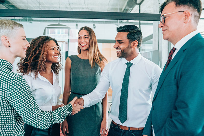 group of people discussing fisher investment's institutional group