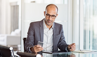 man checking his invsetment portfolio on his phone