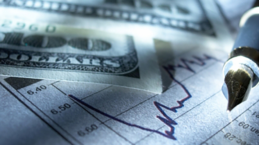 A piece of paper with two one hundred dollar bills and a pen