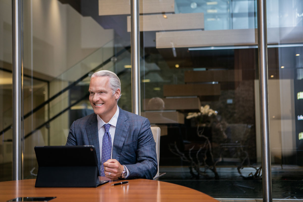 Damian Ornani in a suit smiling  