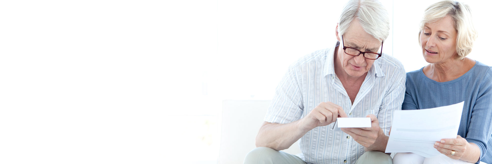 An older couple consult their finances