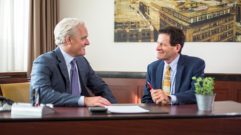 Ken Fisher talking with CEO Damian Ornani