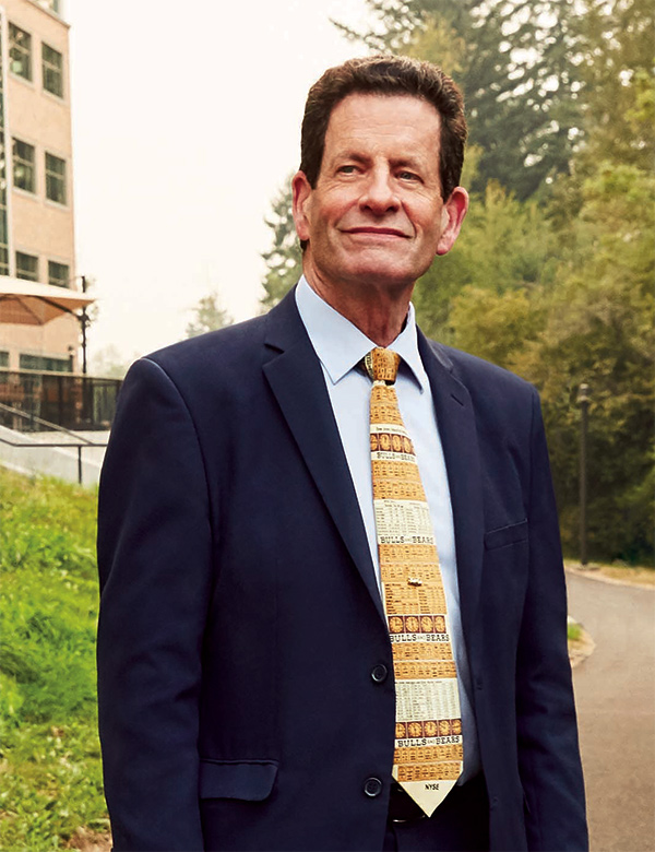 Ken Fisher Standing outside Fisher Creek building