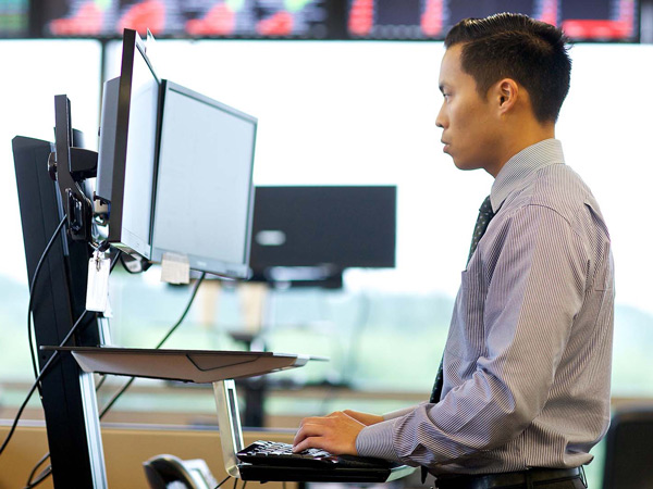 Man working at a standing desk
